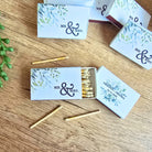 Matchboxes with 'Mr. & Mrs.' design on a wooden surface