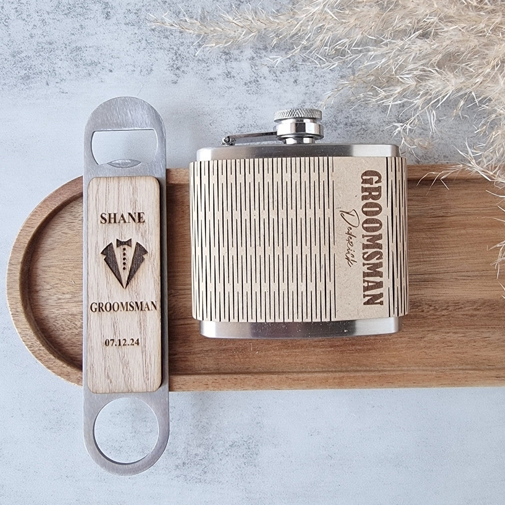 Flask and bottle opener set with 'Groomsman' engraving on a wooden board.