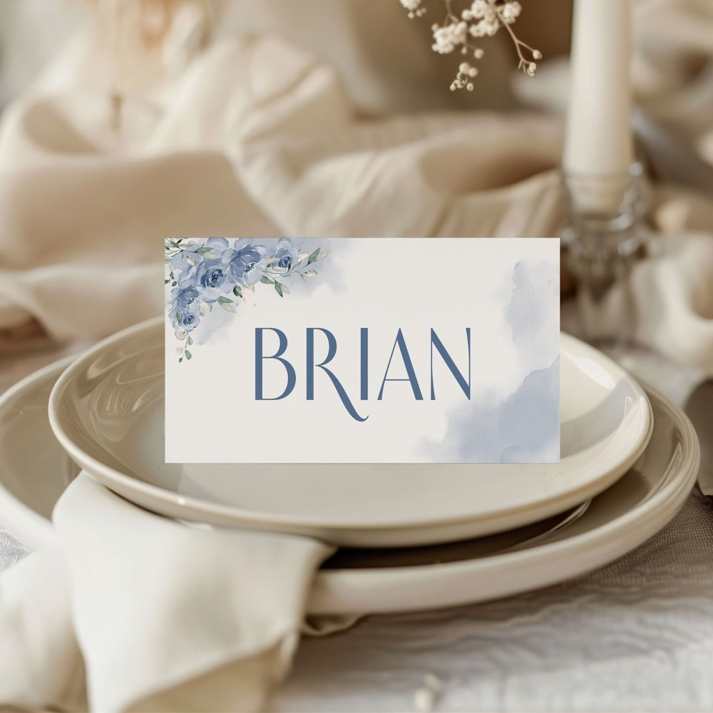 Place card with 'BRIAN' on a table setting with floral decorations