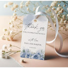 Wedding favour tag with floral design and text on a light background