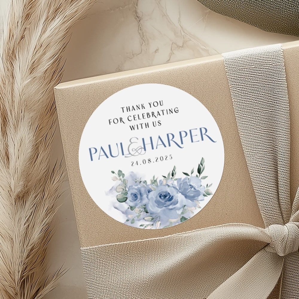 Gift box with a round sticker featuring 'Thank you for celebrating with us' and 'Paul & Harper'