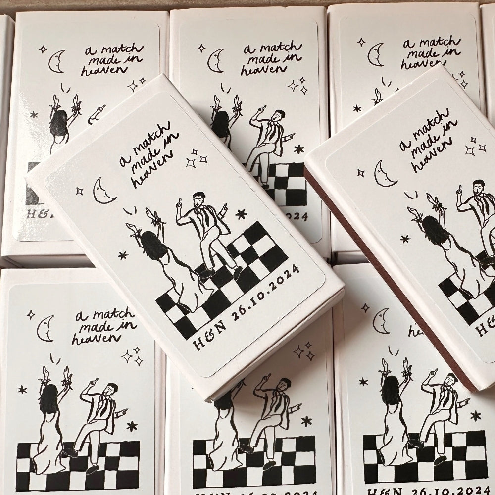Matches with illustrations and text 'a match made in heaven' on a white background