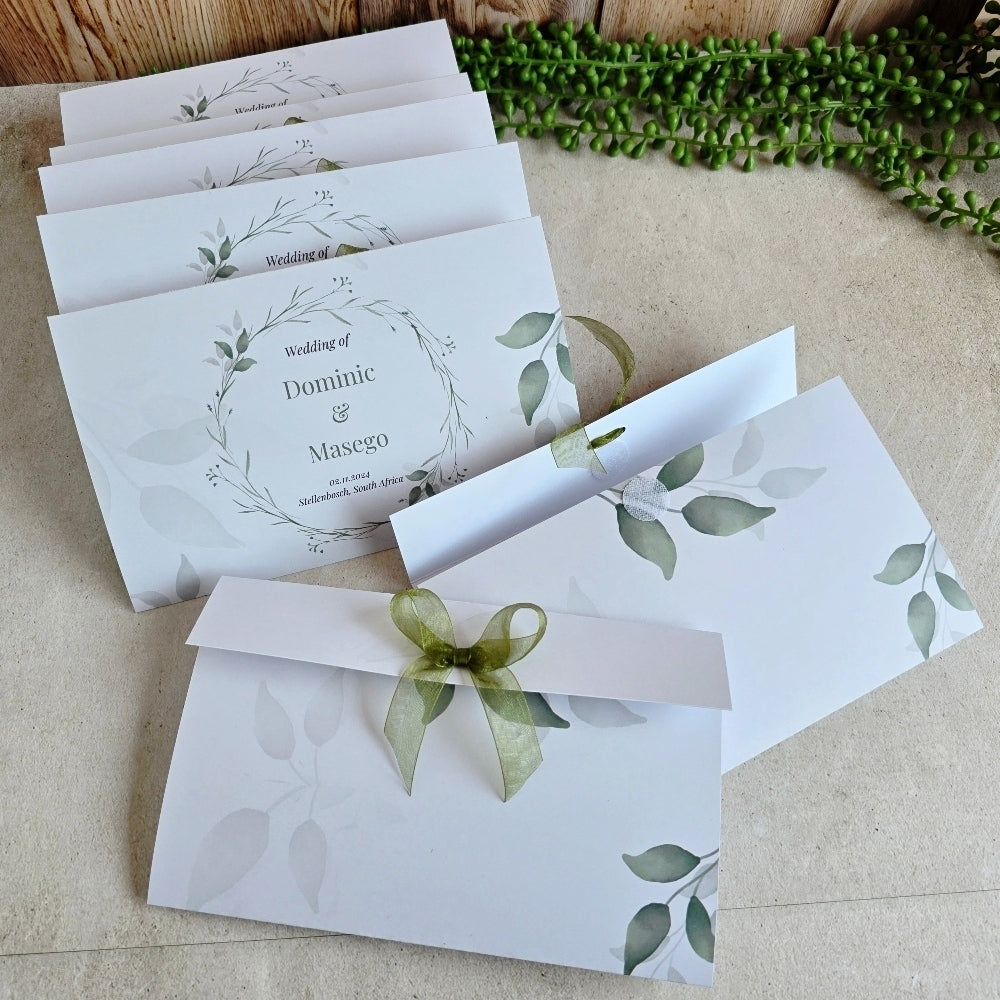 Elegant Green Botanical personalised wedding welcome envelopes designed for holding wedding fans, confetti, tissues, programs, and guest welcome packs.