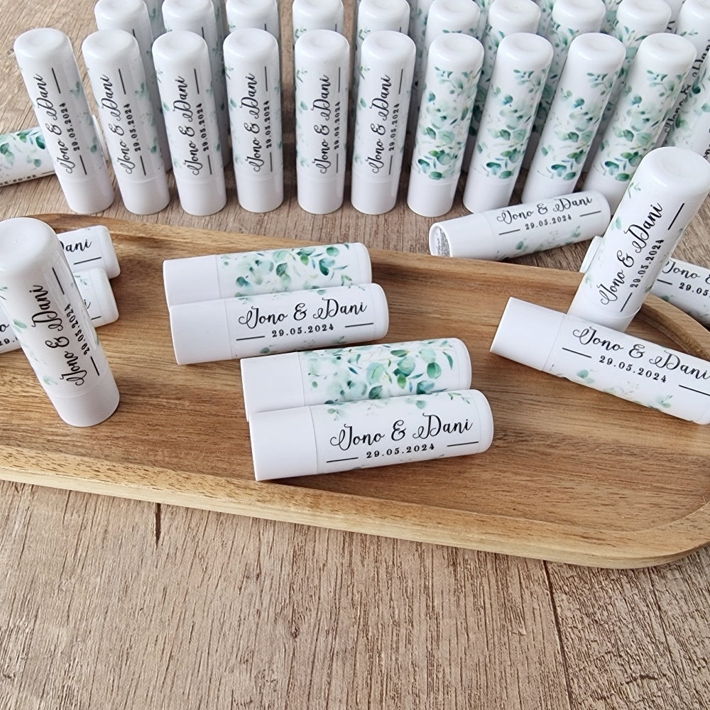 A collection of vanilla lip balm sticks displayed on a wooden tray, with the ability to be personalized with wrapped stickers.