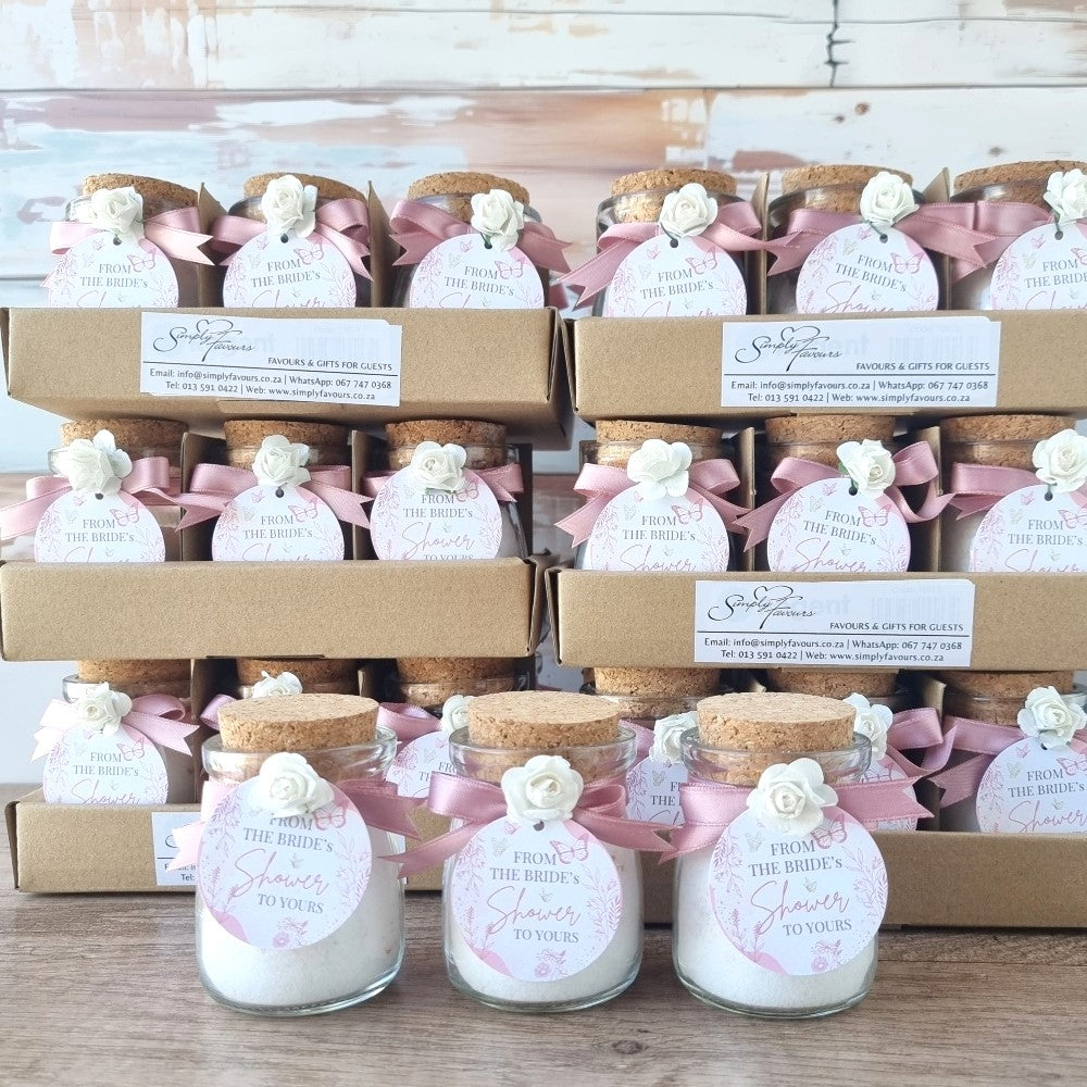 Bridal shower favors with bath salts and decorative ribbons