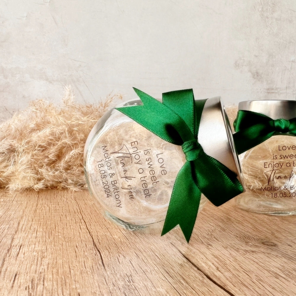 small glass candy jar with personalised sticker and ribbon