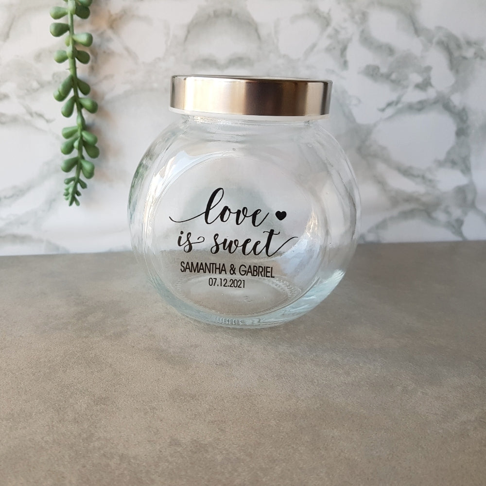 small glass candy jar with personalised sticker and ribbon