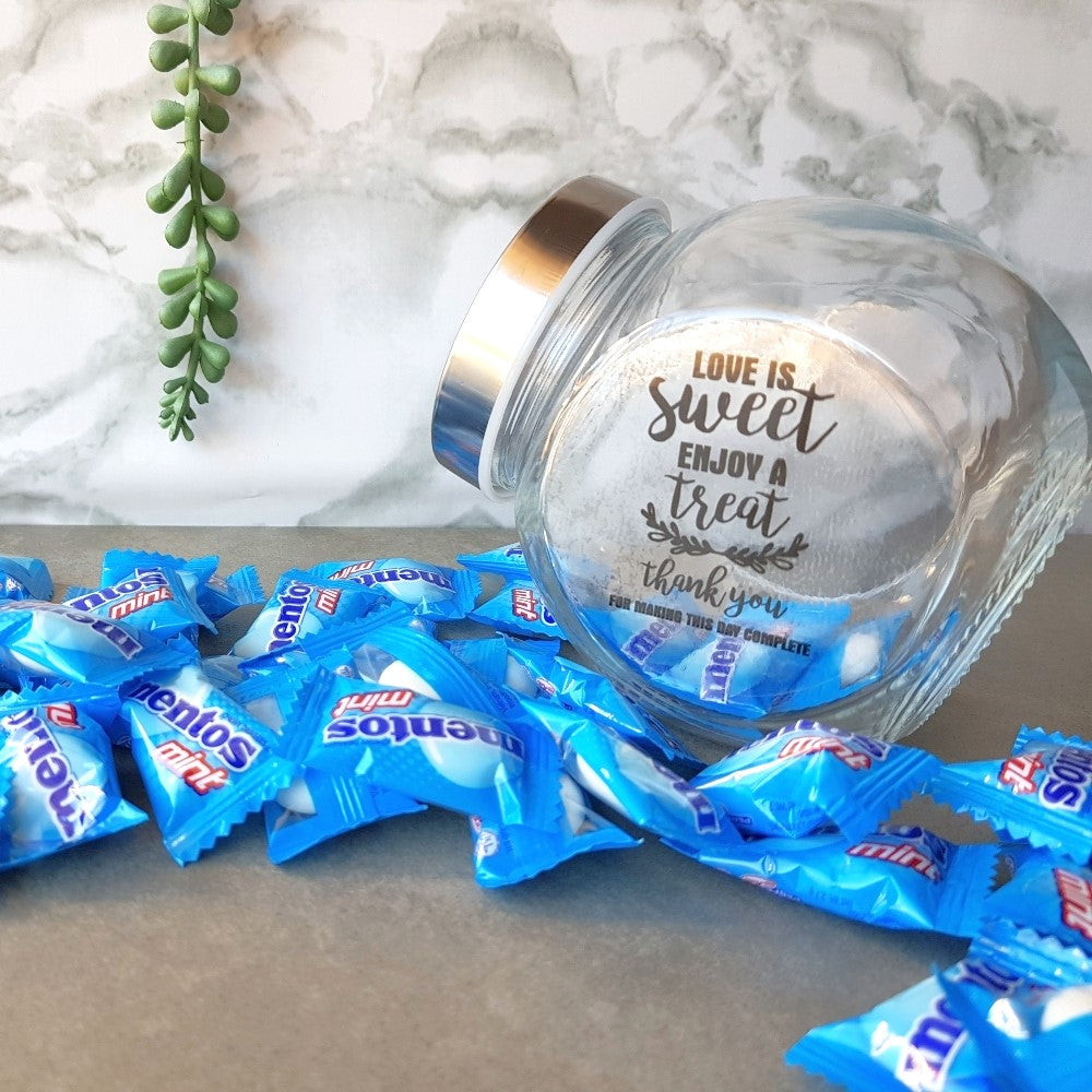 small glass candy jar with personalised sticker and ribbon