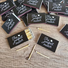 Matches with 'The perfect match' packaging on a wooden surface
