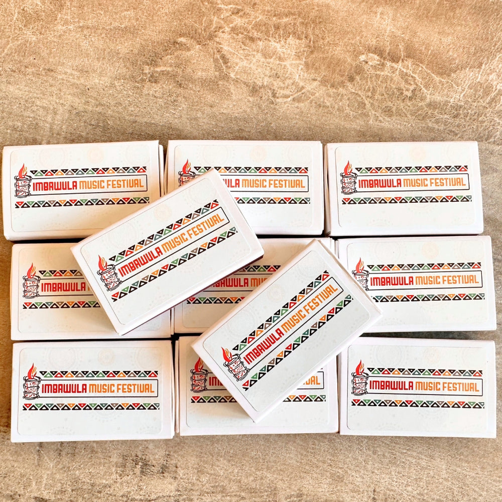 Multiple boxes of Imbawula Music Festival on a wooden surface