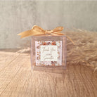 transparent favour boxes with a custom sticker and ribbon