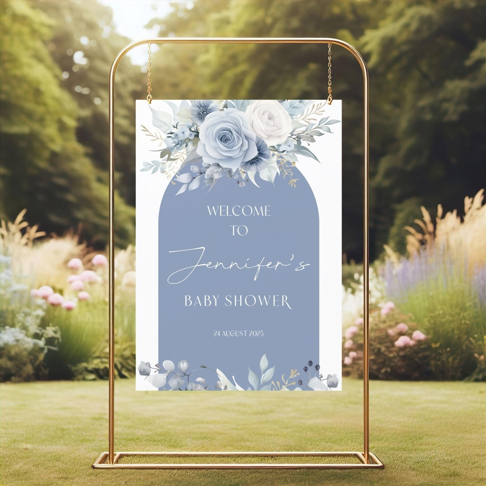 Baby shower welcome sign with floral design on a stand outdoors