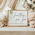 Elegant green botanical wedding sign reading 'Something for you – from the bride and groom', A4 size, printed on cardstock, displayed in a gold frame with white flowers. Frame not included.