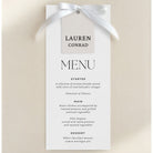 a menu card with a white ribbon and black text, featuring a selection of artisan breads served with olive oil and balsamic vinegar, and a selection of cheeses.