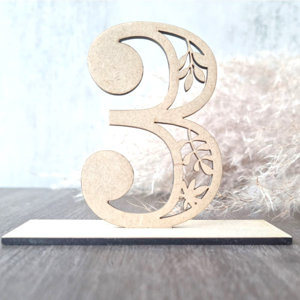 Numerical table number with intricate leaf design