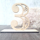 Numerical table number with intricate leaf design