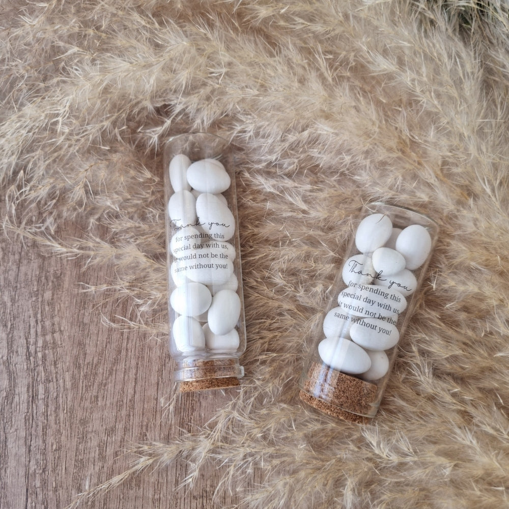White_sugar_coated_almonds in cork  jars