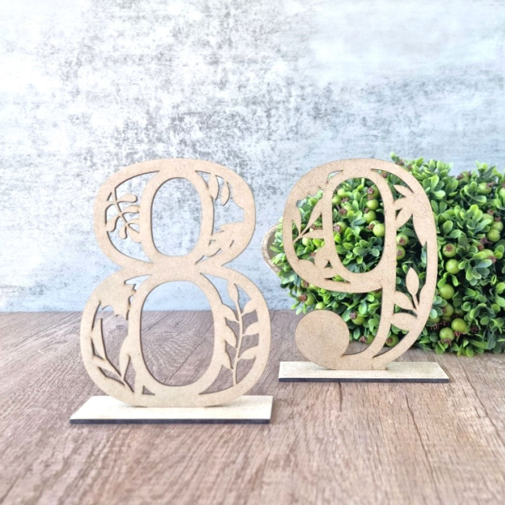 Numerical table number with intricate leaf design