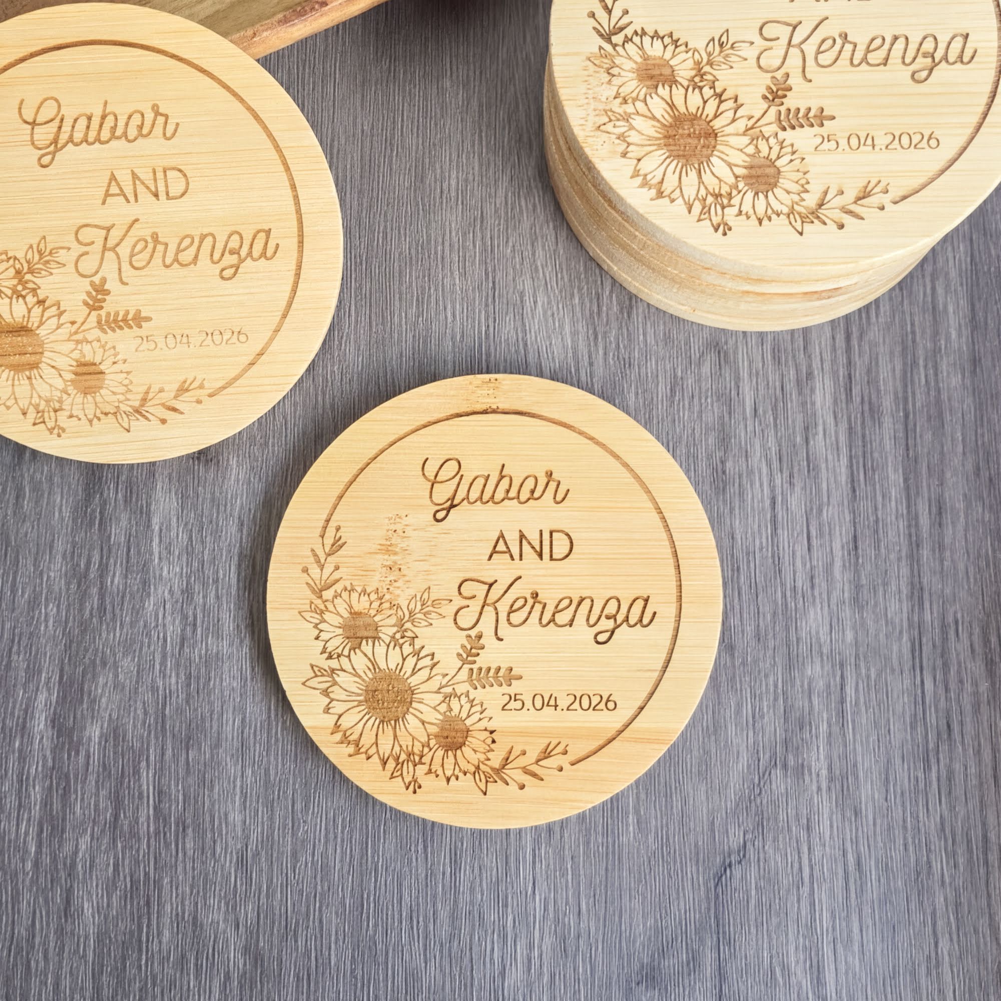 a collection of wooden coasters with floral designs and text engraved on them.