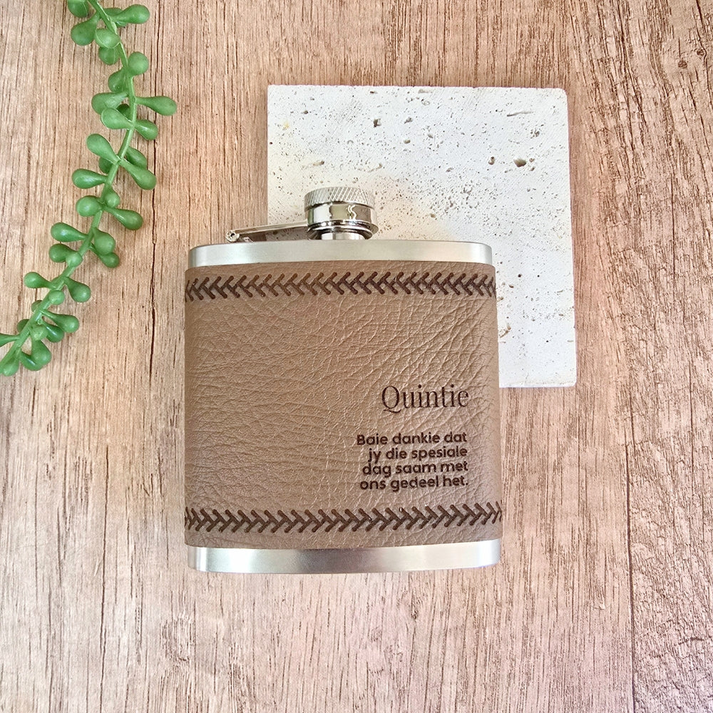 Flask with leather wrap and engraved text