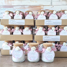 Bridal shower favors with bath salts and decorative ribbons