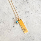 vertical bar with gemstone necklace