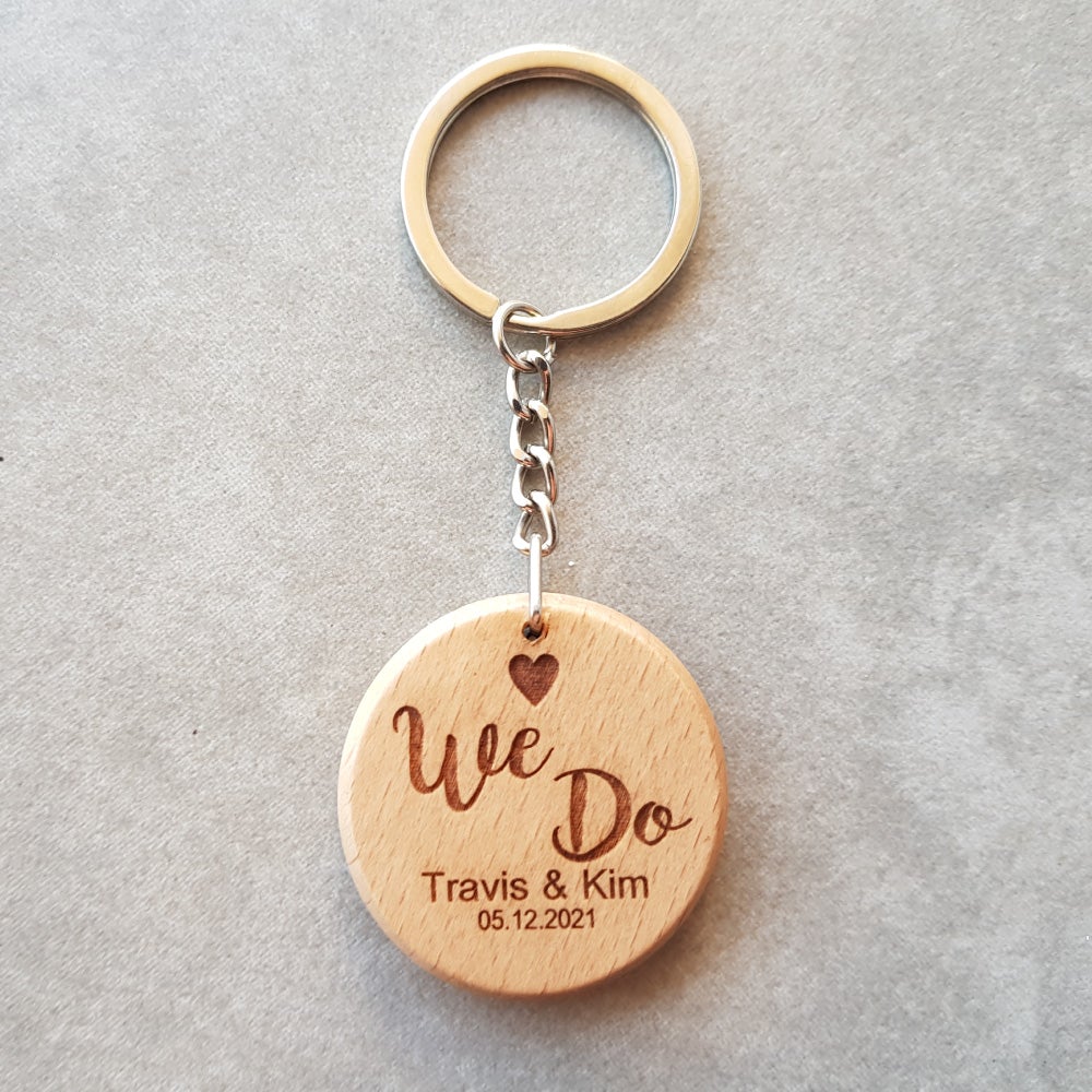 Round beechwood keyring with We do design