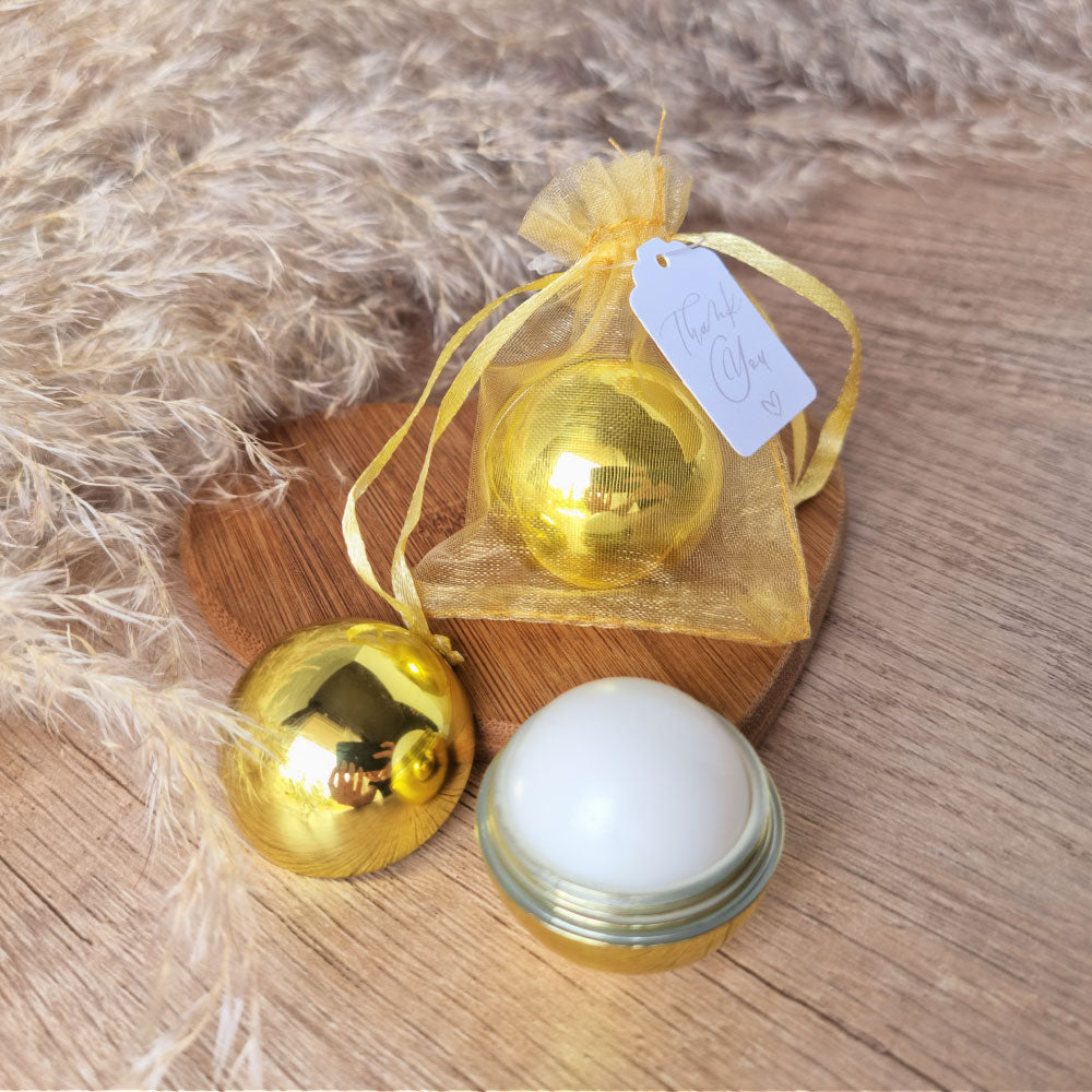 gold-sphere-lip-balm-favour-in-organza-gift-bag