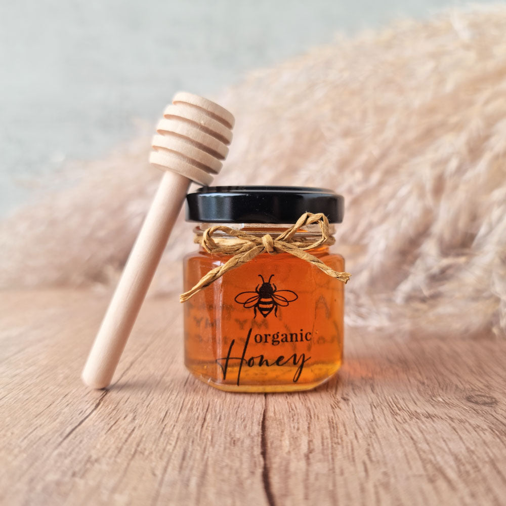 Honey in a hexagonal jar favour