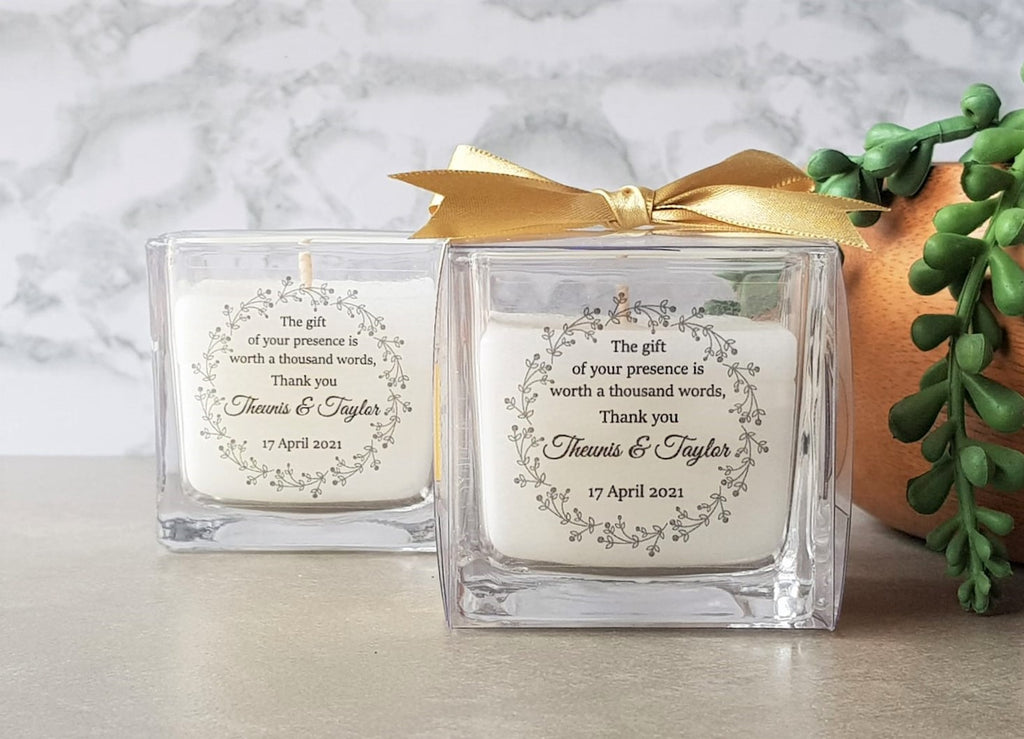 Square candle outside its box with personalised sticker